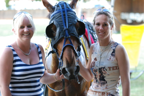 Bettors Expressa after his win with strappers (L-R_ Lydia Graham and Sally Penna
