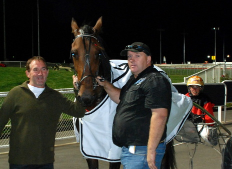 Quastor Centurion with (L-R) owner Greg Pearton trainer Kent Rattray and regular driver Erin Hollaway
