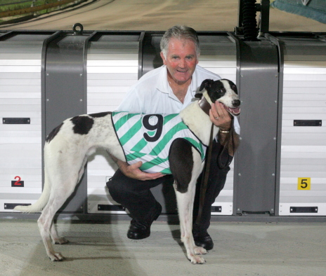 Premier Port with his trainer-owner Geoff Kennedy after the dog's win in Hobart last Thursday night

