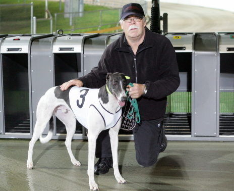 Just As Fancy with trainer Beau Shanahan after the dog's impressive division three final win
