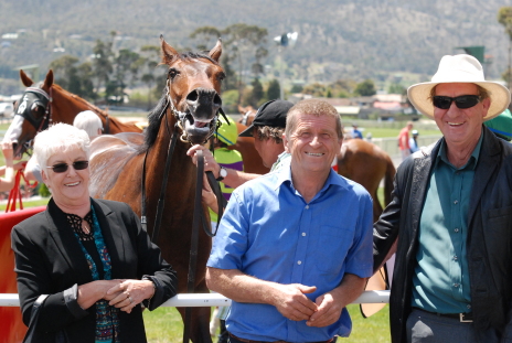 All smiles from owners Wendy and Charlie Langmaid (L & R) trainer Barry Campbell (2nd from right) and even Grand Tycoon is smiling