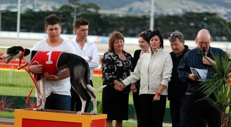 Blake Pursell holds Lika Whisper with trainer Brendan Pursell behind and Lynne Pursell stands with the late Billy Grice's family
