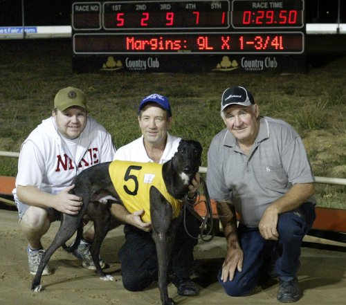 Big Moose with owners (L-R) Justin Crawford, trainer Butch Deverell and owner Brian Crawford after Moose set the Launceston track record
