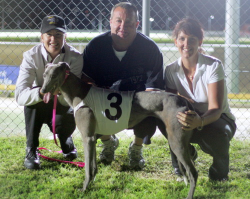 Chiko Roll after her win with L-R trainer Susan Gittus and kennel assistants Shane Withers and Carolyn Mart
