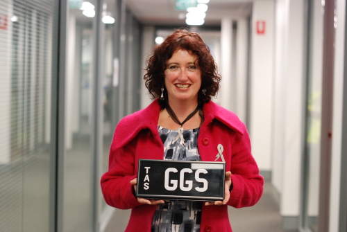 Think Pink Day event co-ordinator Judi Adams holds the one-off set of number plates that will be actioned on Sunday

