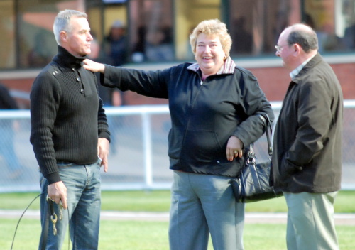 Trainer Gary White is congratulated by two of Ammalite's happy owners

