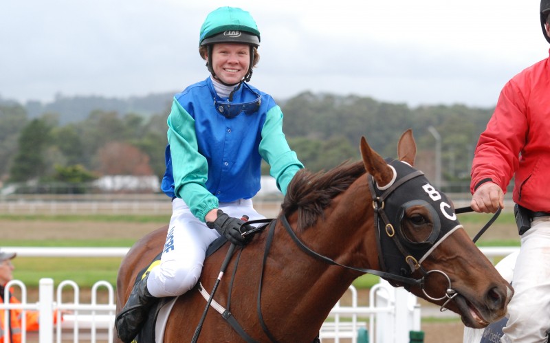 Hayley McCarthy is all smiles after guiding Evil Intent to victory at Devonport