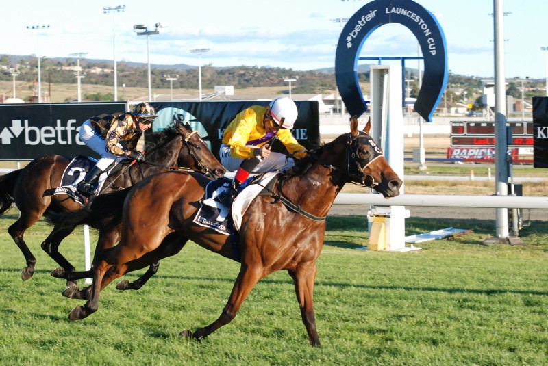 Apprentice Ismail Toker guides Lazy Democracy to victory in a Class 4 Hcp in Launceston